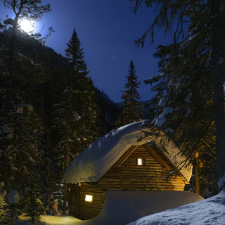 Fairy house in the forest moonlit winter night