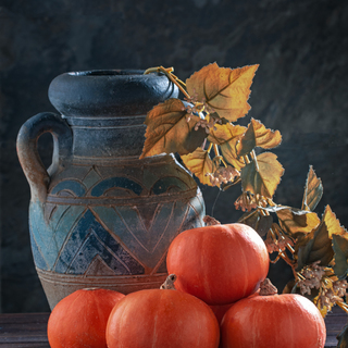 Still life with pumpkins and  jug.
Toned.Colors of autumn.