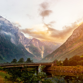 Beautiful views of the sunrise over the fjord and mountains from the bridge in the Norwegian village of Gudvangen.