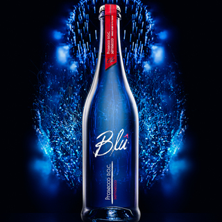 Bottle of Blu Prosecco D.O.C. with abstract lights in the background