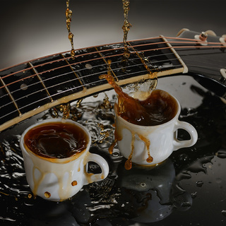 Concept acoustic guitar and two cups of coffee.