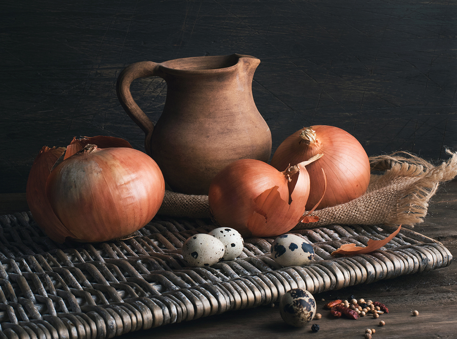 Still life with onions, quail eggs and clay jug