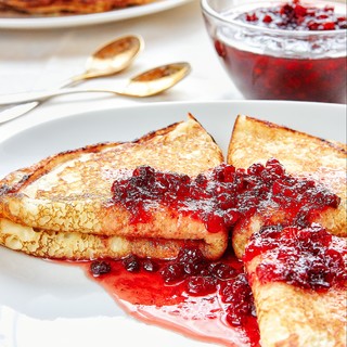 Healthy breakfast with fresh hot pancakes with berry jam