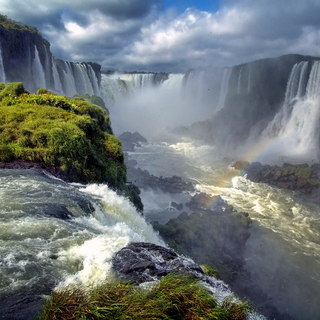 Landscape of big beautiful waterfalls with rainbow, Cataratas do Iguacu (Iguazu Falls), Foz do Iguacu, Parana State, South Brazil