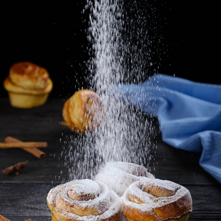 Cinnamon rolls with powdered sugar.