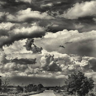 Travel to Ukraine road in an industrial area with gorgeous clouds.