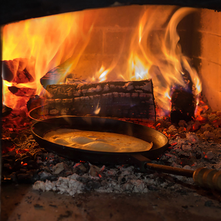 web-pan with pancake in the oven. Pancake week