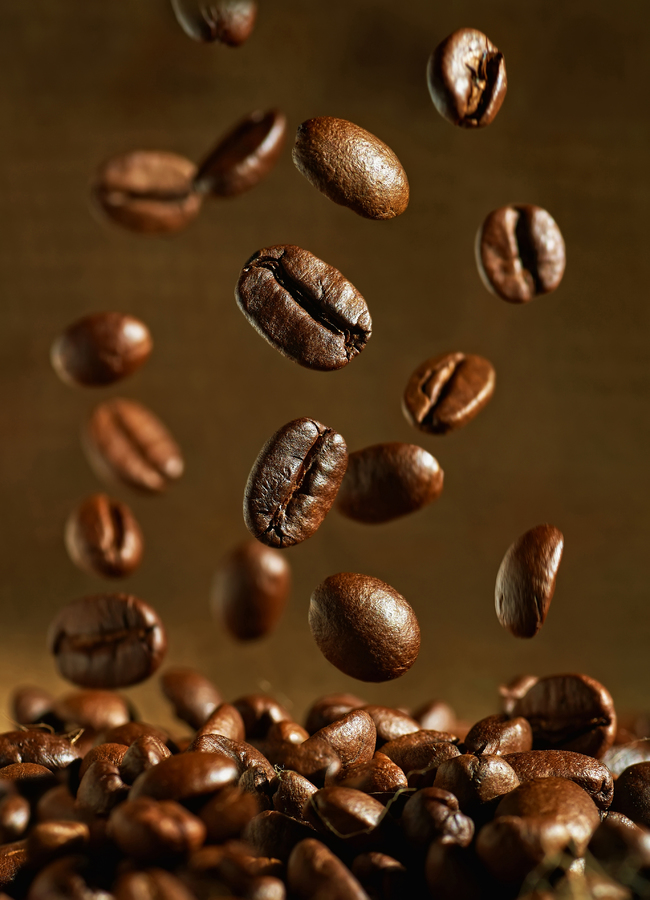 Closeup of coffee beans with focus on one