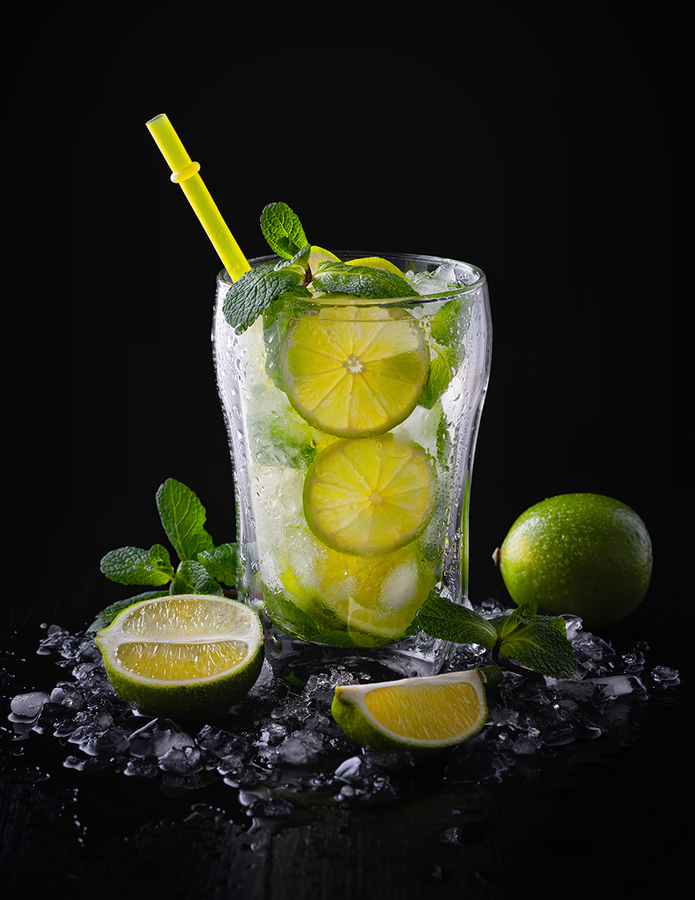 Refreshing summer alcoholic cocktail mojito with ice, fresh mint and lime. Copy Space.