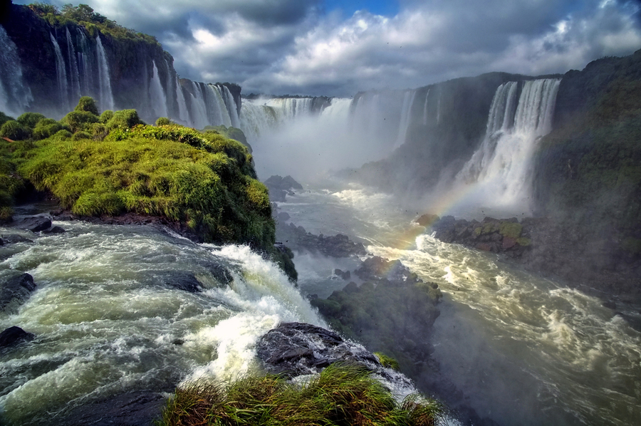 Landscape of big beautiful waterfalls with rainbow, Cataratas do Iguacu (Iguazu Falls), Foz do Iguacu, Parana State, South Brazil